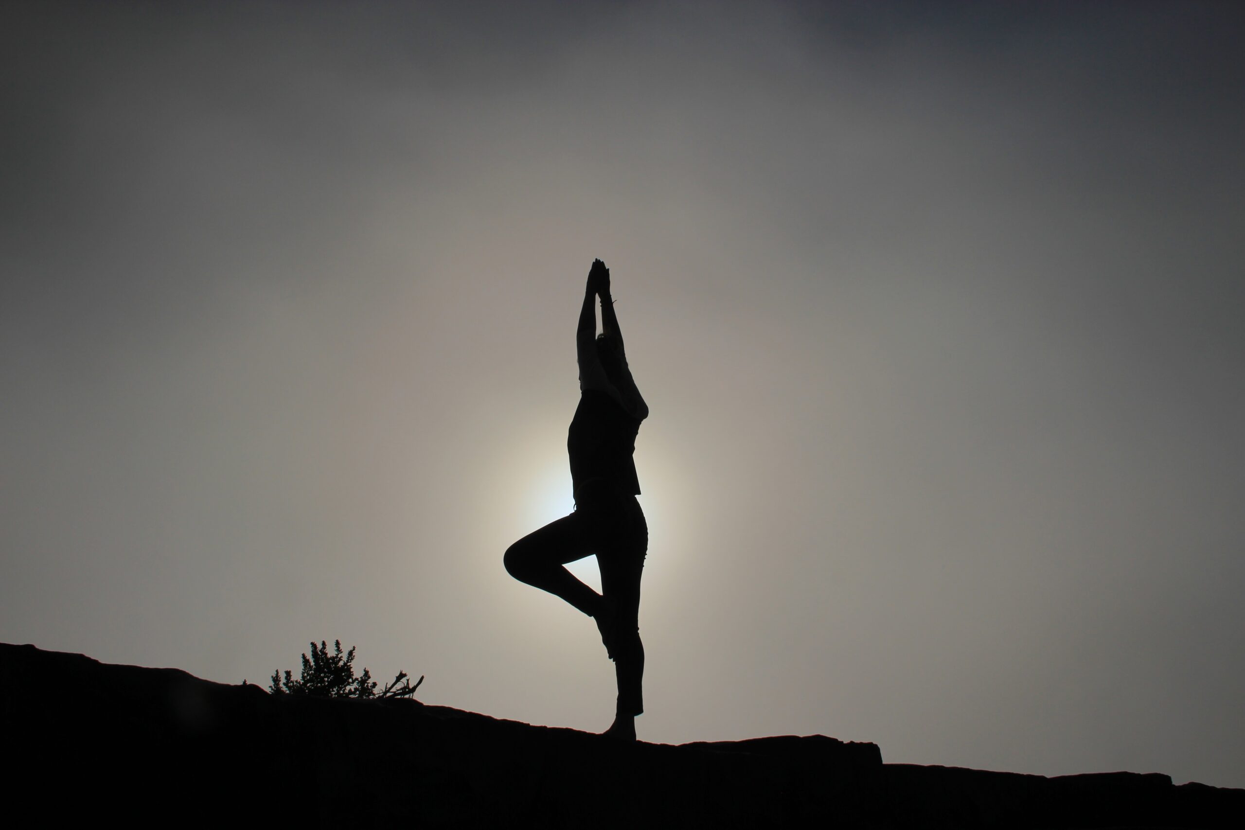Yoga mat with phone showing yoga video